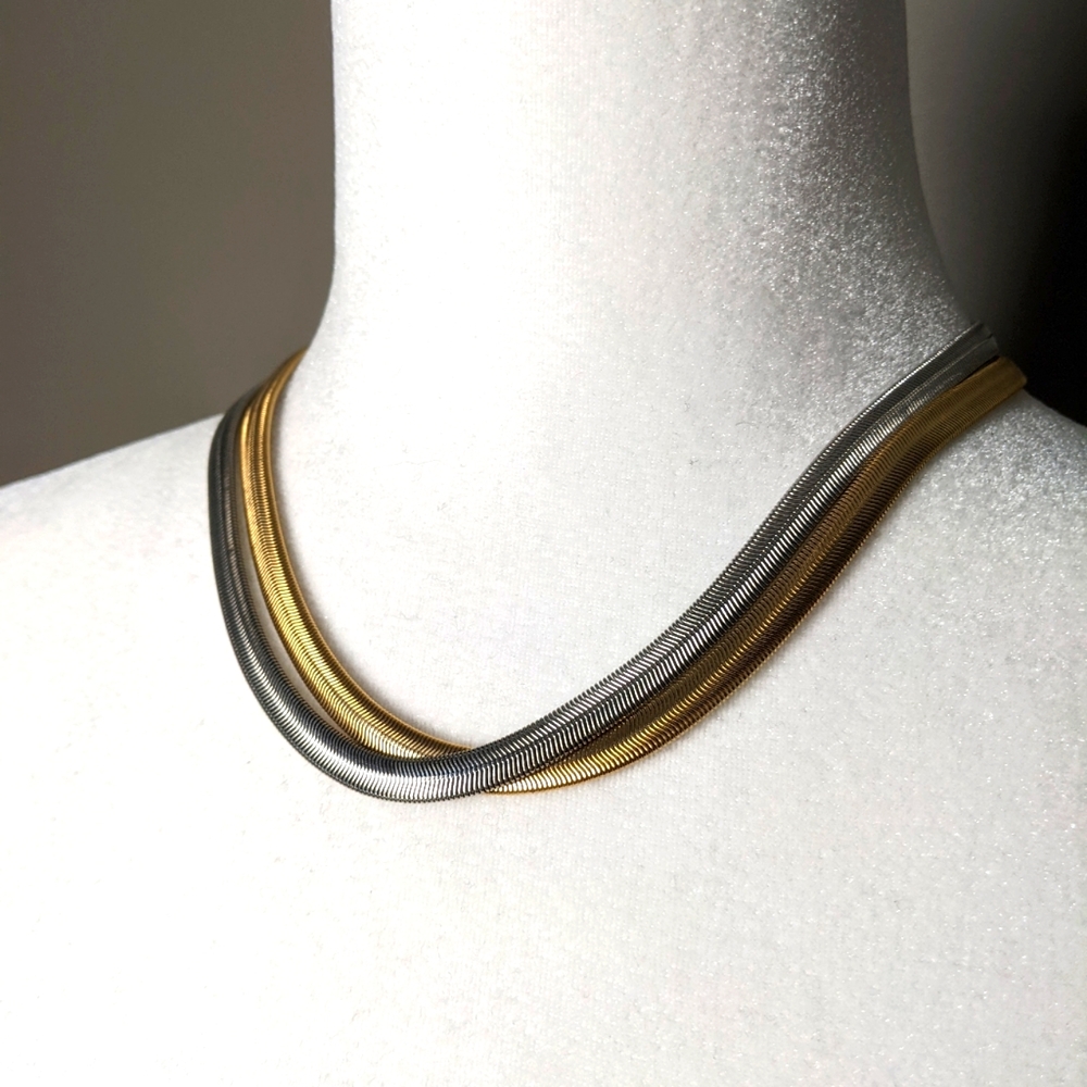 Jewelmint mixed metal gold and silver crossed snake chain clasped necklace